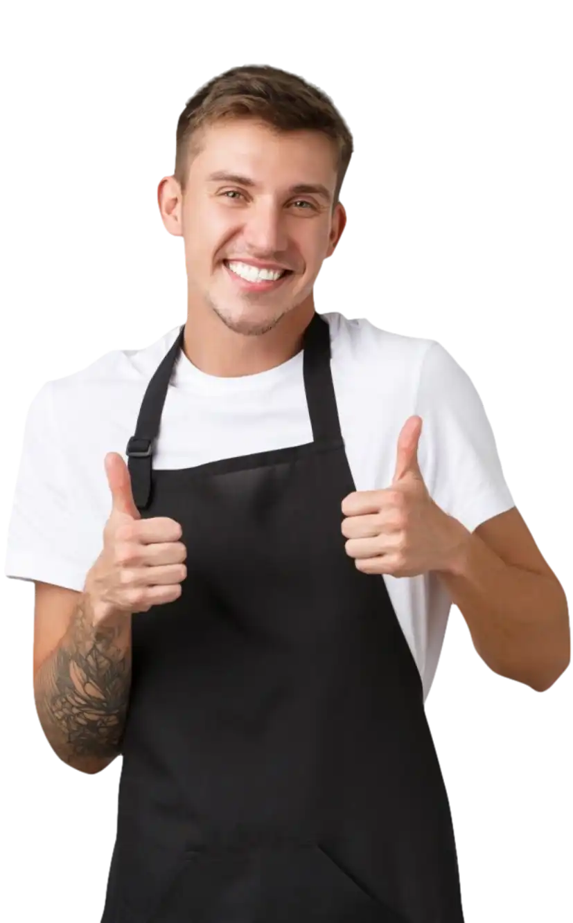 restaurant worker with tattoos smiling thumbs up young apron